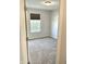 An empty bedroom showcasing neutral walls and carpet with a window at 1327 Blue Ridge Ln, Brownsburg, IN 46112