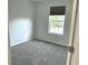 Empty bedroom with carpet, neutral walls, and a window with a shade at 1327 Blue Ridge Ln, Brownsburg, IN 46112
