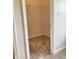 A compact walk-in closet featuring carpeting and a shelf at 1327 Blue Ridge Ln, Brownsburg, IN 46112