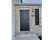 The front door is black with brick accents and decorative lighting near the entryway at 1327 Blue Ridge Ln, Brownsburg, IN 46112