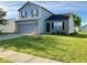 Charming two-story home with a well-manicured lawn and a two car garage at 1327 Blue Ridge Ln, Brownsburg, IN 46112