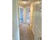 Hallway with neutral-toned carpet, offering glimpses into adjacent rooms at 1327 Blue Ridge Ln, Brownsburg, IN 46112