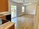 Bright eat-in kitchen with sliding glass doors leading to the outside and laminate floors at 1327 Blue Ridge Ln, Brownsburg, IN 46112