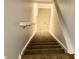 A staircase with carpeted steps and wood handrail leads to the upper level at 1327 Blue Ridge Ln, Brownsburg, IN 46112