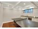 Finished basement features a ping pong table, wet bar with granite countertops, and recessed lighting at 8819 Anchor Bay Ct, Indianapolis, IN 46236