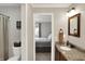 Bathroom leading into bedroom featuring neutral colors, granite sink and shower with curtain at 8819 Anchor Bay Ct, Indianapolis, IN 46236