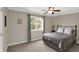 Relaxing bedroom with natural lighting from large window, and view of the outdoor scenery at 8819 Anchor Bay Ct, Indianapolis, IN 46236