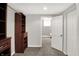Walk-in closet with carpet flooring, built in wood storage shelves and grey walls at 8819 Anchor Bay Ct, Indianapolis, IN 46236