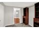 Walk-in closet with carpet flooring, built in wood storage shelves and grey walls at 8819 Anchor Bay Ct, Indianapolis, IN 46236