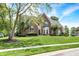 Attractive red brick home featuring a well-kept lawn and lush greenery at 8819 Anchor Bay Ct, Indianapolis, IN 46236