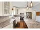 Bright kitchen featuring white cabinets, granite countertops, stainless steel appliances, and a center kitchen island at 8819 Anchor Bay Ct, Indianapolis, IN 46236