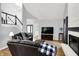 Comfortable living room with a fireplace and stairs in the background at 8819 Anchor Bay Ct, Indianapolis, IN 46236