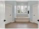 Bright main bathroom with tile floors and a luxurious sunken tub under a large window at 8819 Anchor Bay Ct, Indianapolis, IN 46236