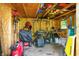 Outdoor storage shed filled with an assortment of tools and gardening equipment at 8819 Anchor Bay Ct, Indianapolis, IN 46236
