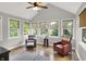 Cozy sunroom with a vaulted ceiling and multiple windows providing natural light at 8819 Anchor Bay Ct, Indianapolis, IN 46236