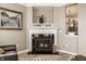 Close-up of a cozy fireplace with white mantel and decorative accents at 958 Rosalind Pl, Carmel, IN 46032