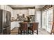 Bright kitchen featuring stainless steel appliances, a kitchen island, and white cabinets at 958 Rosalind Pl, Carmel, IN 46032