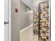 Hallway featuring a decorative screen, neutral paint, and tiled flooring leading to other rooms at 102 Clarendon Dr # 409, Noblesville, IN 46062