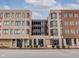 Modern apartment building exterior with commercial space, ample windows at 319 E 16Th St # 207, Indianapolis, IN 46202