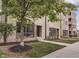 Apartment building exterior with landscaping and well-manicured lawn at 319 E 16Th St # 207, Indianapolis, IN 46202