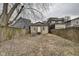 Fenced backyard with a small patio, steps and grass area at 1433 E Fletcher Ave, Indianapolis, IN 46203