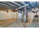 Unfinished basement with concrete floor, painted walls and ceiling, and exposed utilities at 1433 E Fletcher Ave, Indianapolis, IN 46203