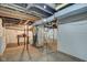 Unfinished basement with exposed ductwork, utilities, concrete floor and white painted walls at 1433 E Fletcher Ave, Indianapolis, IN 46203