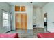 Spacious bedroom with a closet, natural light, modern decor, and vinyl flooring at 1433 E Fletcher Ave, Indianapolis, IN 46203