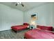 Inviting bedroom with two beds, a ceiling fan, and a view of the room's entryway and door at 1433 E Fletcher Ave, Indianapolis, IN 46203