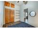 Cozy bedroom with closet and shelves, neutral walls, and vinyl flooring at 1433 E Fletcher Ave, Indianapolis, IN 46203