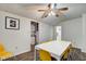 Bright dining room with seating for 6, ceiling fan, and hardwood floors at 1433 E Fletcher Ave, Indianapolis, IN 46203