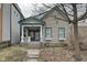 Charming home featuring a covered porch, well-maintained siding, and a welcoming facade at 1433 E Fletcher Ave, Indianapolis, IN 46203