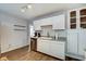 Bright kitchen featuring white cabinetry, stainless steel dishwasher, and modern fixtures at 1433 E Fletcher Ave, Indianapolis, IN 46203