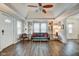 Cozy living room with natural light, built-in shelving, and wood floors at 1433 E Fletcher Ave, Indianapolis, IN 46203