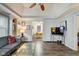 Bright living room featuring hardwood floors, built in shelves, and an open floor plan at 1433 E Fletcher Ave, Indianapolis, IN 46203