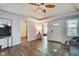 Open living room featuring ceiling fan, wood flooring, and lots of light at 1433 E Fletcher Ave, Indianapolis, IN 46203