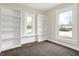 Bright bedroom with built-in shelving and windows at 1901 N Tillotson Ave, Muncie, IN 47304