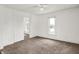 Open bedroom featuring a doorway to another room at 1901 N Tillotson Ave, Muncie, IN 47304