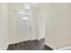 Bright entryway featuring hardwood floors and white trim at 1901 N Tillotson Ave, Muncie, IN 47304