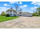 View of the house with a detached garage at 1901 N Tillotson Ave, Muncie, IN 47304