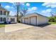 A detached garage with multiple bays and a paved driveway at 1901 N Tillotson Ave, Muncie, IN 47304
