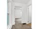 Hallway with neutral carpet and natural light streaming through a window at 1901 N Tillotson Ave, Muncie, IN 47304
