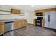 Charming kitchen featuring wood cabinets, stainless steel appliances, and a modern black oven at 1901 N Tillotson Ave, Muncie, IN 47304