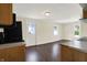An open kitchen with hardwood flooring at 1901 N Tillotson Ave, Muncie, IN 47304