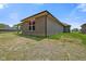 Brick exterior with an unfenced backyard, shows the house's simple design at 2184 Galleone Way, Plainfield, IN 46168