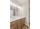 Bright bathroom features double sinks, sleek lighting, and a glass-enclosed shower at 2184 Galleone Way, Plainfield, IN 46168