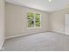 Carpeted bedroom featuring a window with natural lighting, painted in neutral tones at 2184 Galleone Way, Plainfield, IN 46168