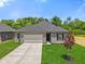 Charming one-story home with a well-manicured lawn and a two-car attached garage at 2184 Galleone Way, Plainfield, IN 46168