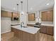 Modern kitchen with wood cabinets, white countertops, and stainless steel appliances at 2184 Galleone Way, Plainfield, IN 46168