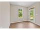 Bright living room with wood-look floors and a glass-paned door to the outdoors at 2184 Galleone Way, Plainfield, IN 46168